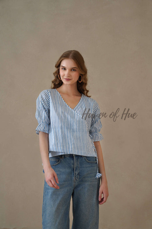 Front view of a sky blue and white striped wrap top featuring short puff sleeves and a side tie.